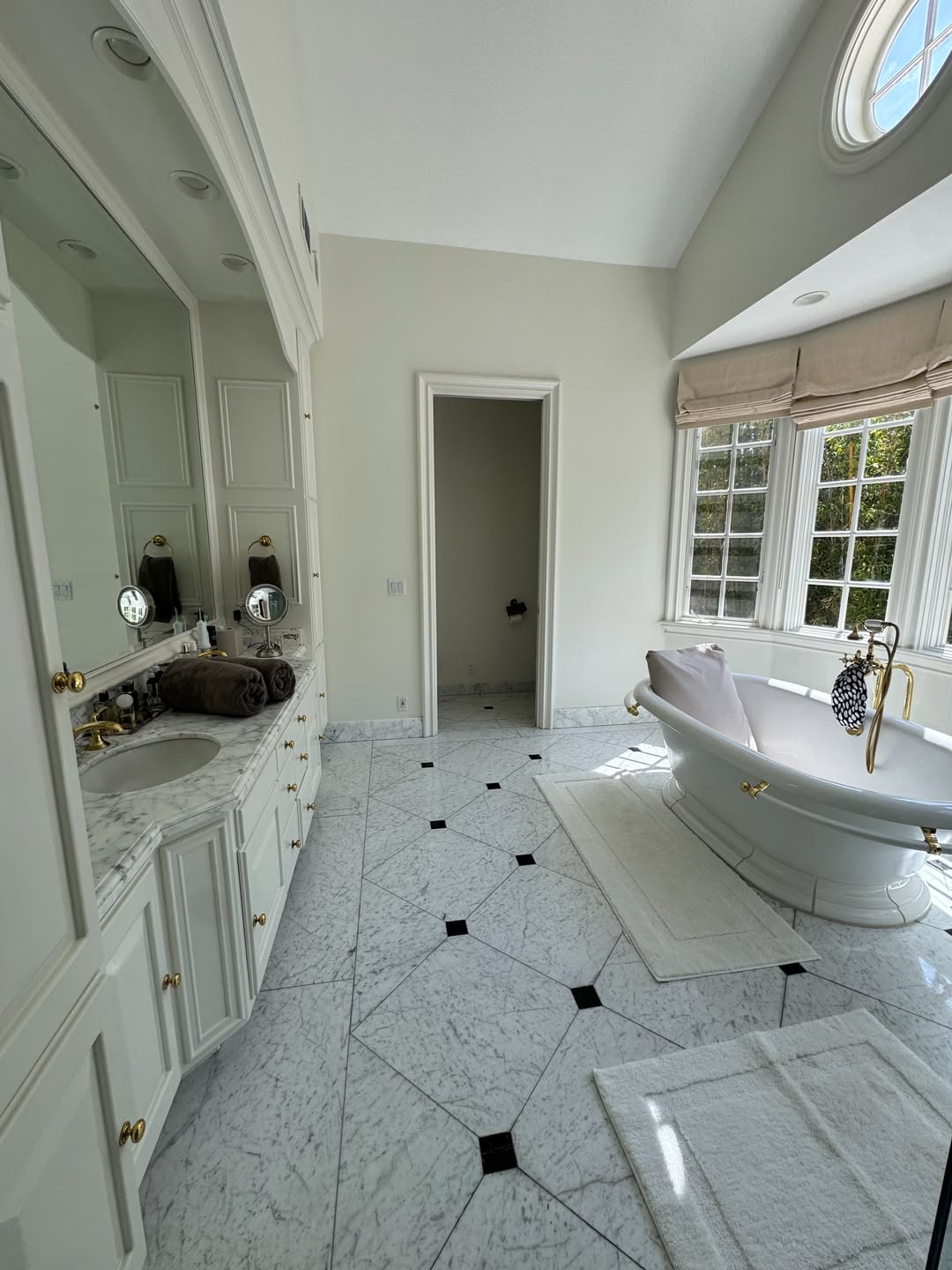 Luxury clean bathroom double vanity and clawfoot tub